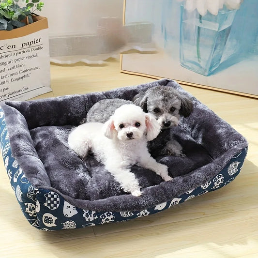 Two small dogs resting comfortably in a blue printed BeiYu plush sofa bed with a grey interior.