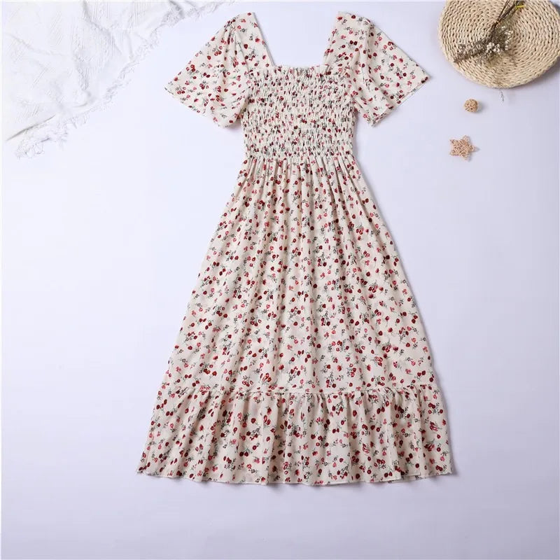 White chiffon midi dress with red floral print featuring a smocked bodice, square neckline, and butterfly sleeves.