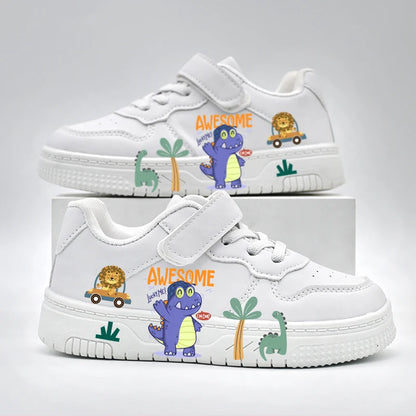 Pair of white children's sneakers featuring colorful dinosaur and lion cartoon prints with a velcro strap.