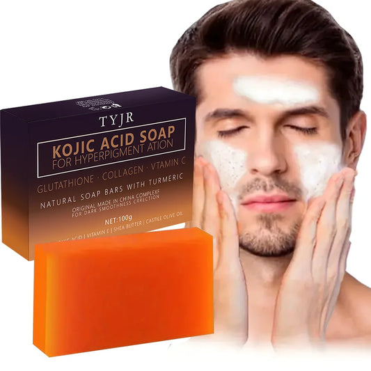 Orange handmade Kojic Acid soap bar with black packaging designed for dark spot correction and skin smoothness.