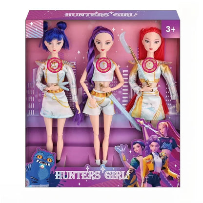 Sealed Bandai box pack featuring three 11.5-inch K-Pop Demon Hunters dolls with light-up musical buttons and stage weapons.