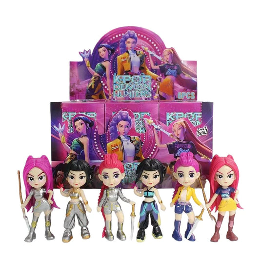 A counter display pack of Bandai K-Pop Demon Hunters blind boxes with six unboxed mini PVC figures lined up in front.