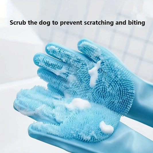 Close-up of blue silicone grooming gloves with shampoo foam highlighting the dense scrubbing bristles.